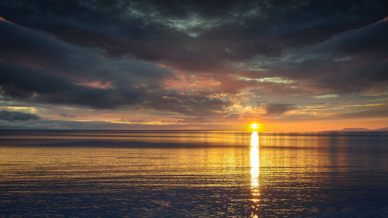Sun Ray Reflection Reflection of the Sun on Water Surface during Sunset · Free Stock Photo