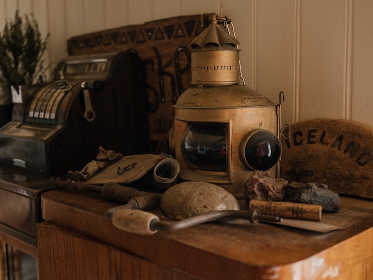 Antique Objects On Top Of A Wooden Cabinet