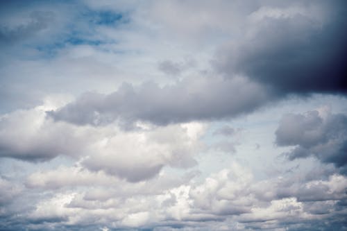 From below of dramatic overcast sky full of gray clouds in gloomy weather