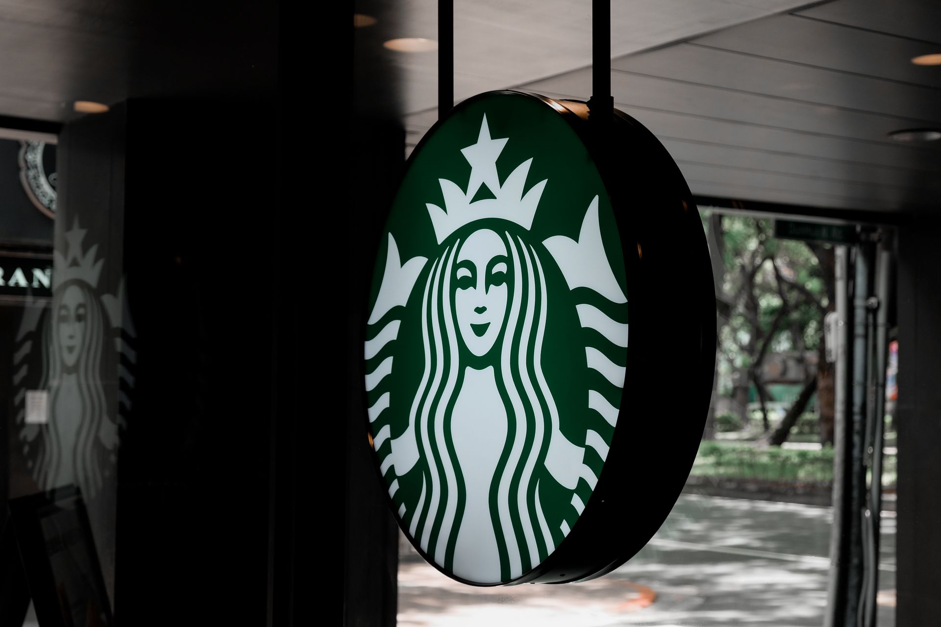 Close-up Photo of a Hanging Starbucks Signage