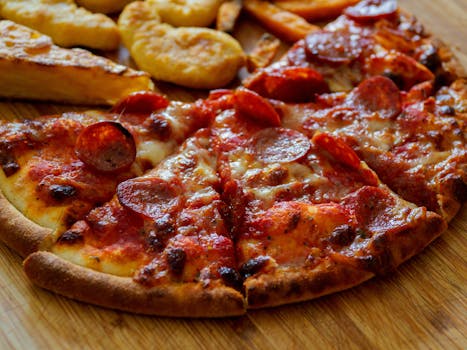 Delicious pepperoni pizza slices on a wooden board, perfect for fast food lovers.