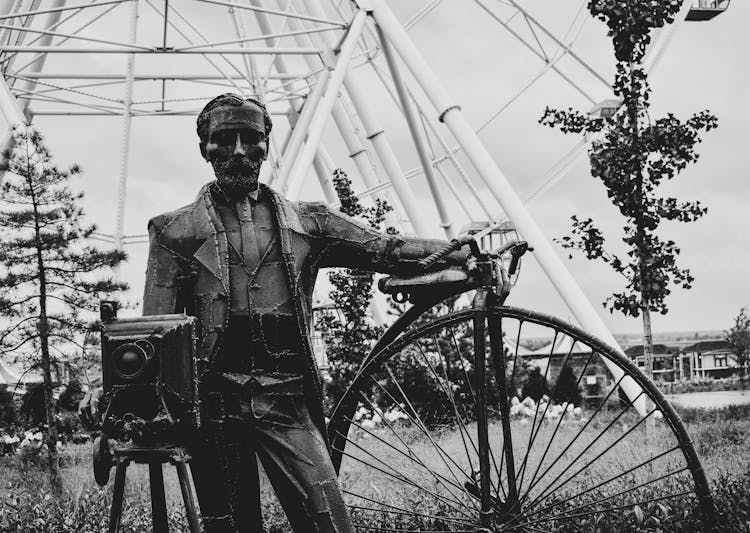 Statue Of A Man And A Unicycle