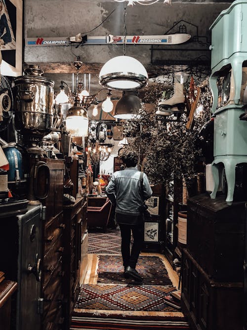Person standing in vintage antique shop
