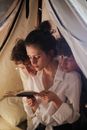 Woman in White Button Up Shirt Holding Smartphone