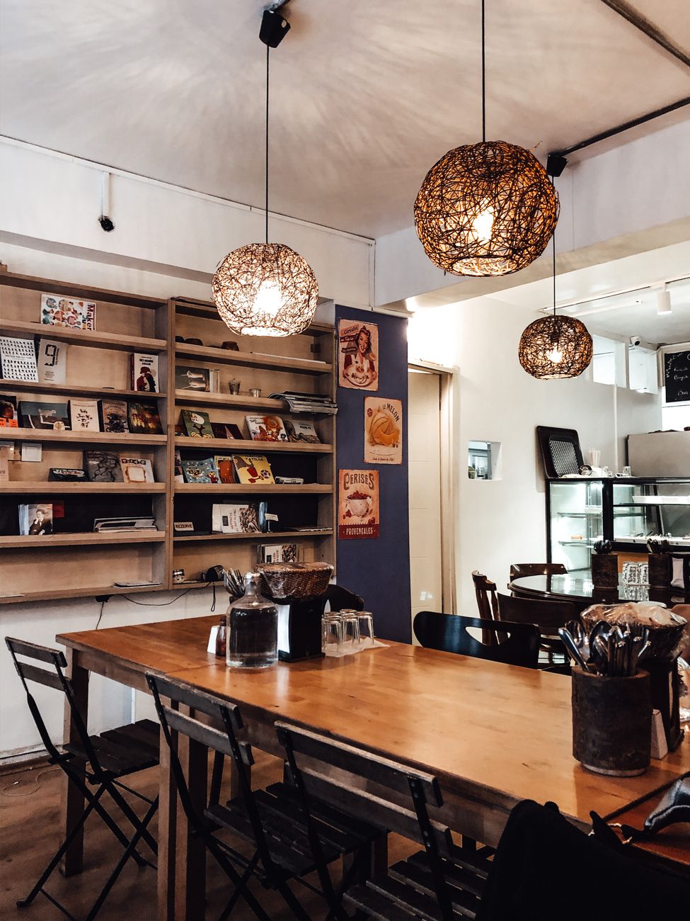 Table Inside Cafe Stylish interior of cafe with big table · Free Stock Photo