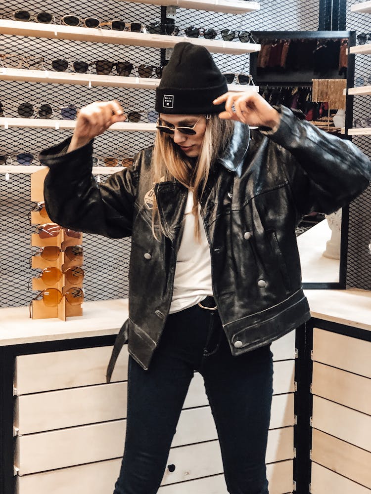 Stylish Woman Trying On Sunglasses In Shop