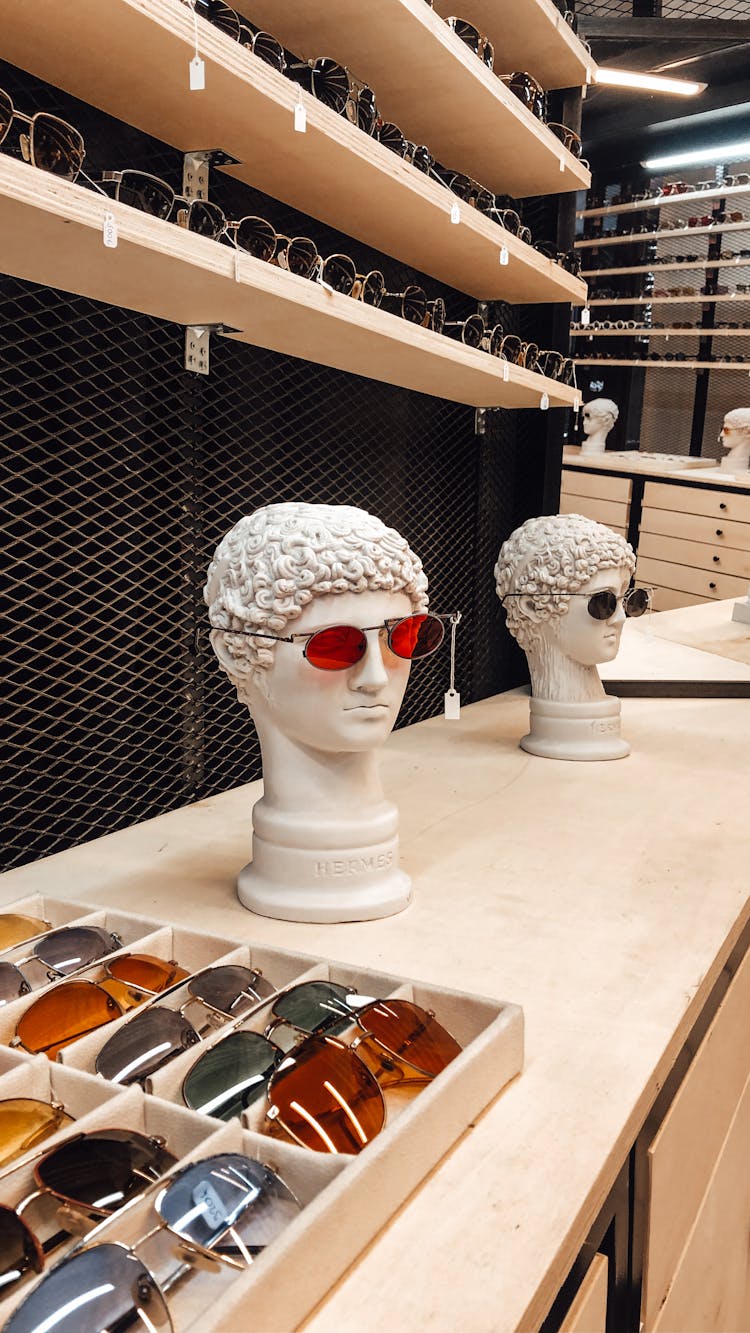 Shop Counter With Glasses And Decorative Busts