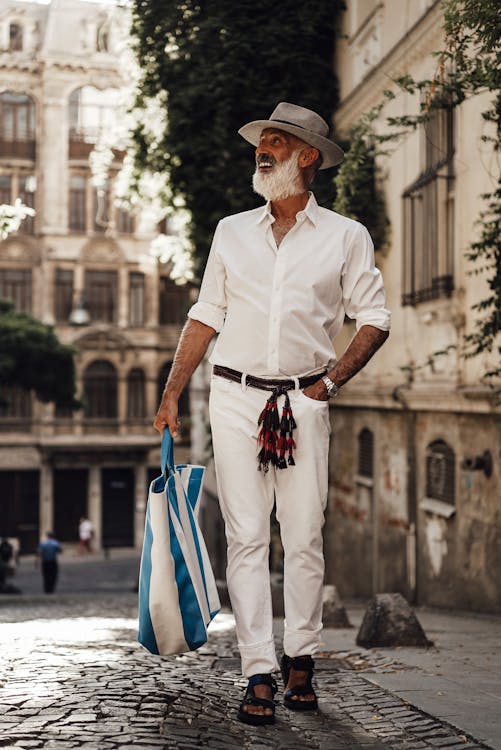 Stylish senior man walking on street · Free Stock Photo