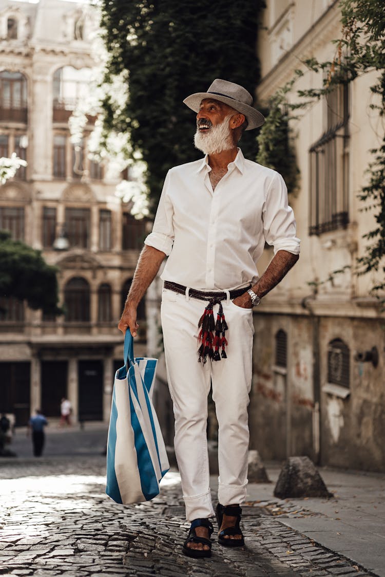 Stylish Senior Man Walking On Street