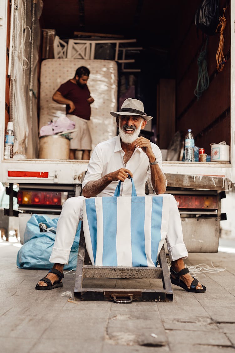 Positive Senior Man In Stylish Clothes Sitting Near Small Truck