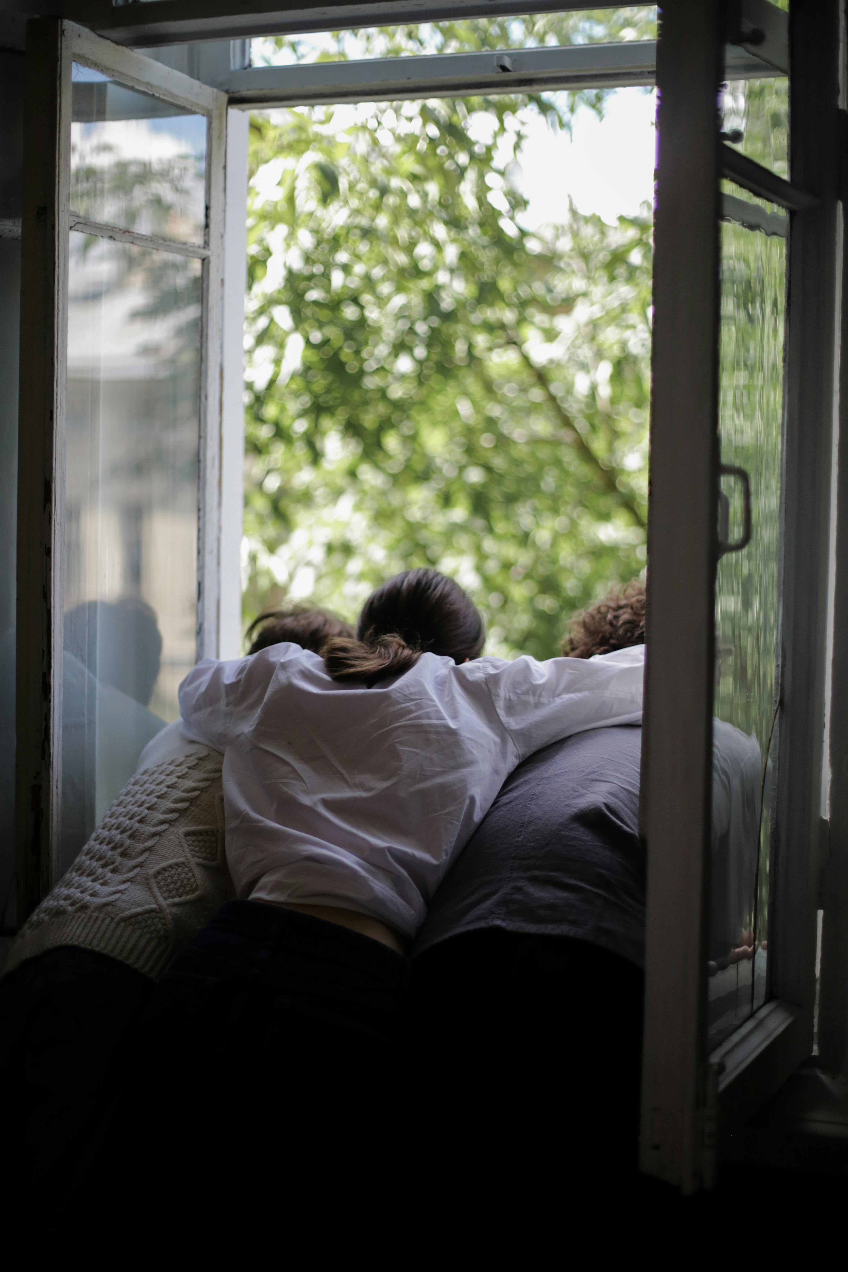 man and woman lying on bed