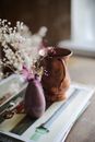 Pink and White Flowers in Brown Ceramic Vase