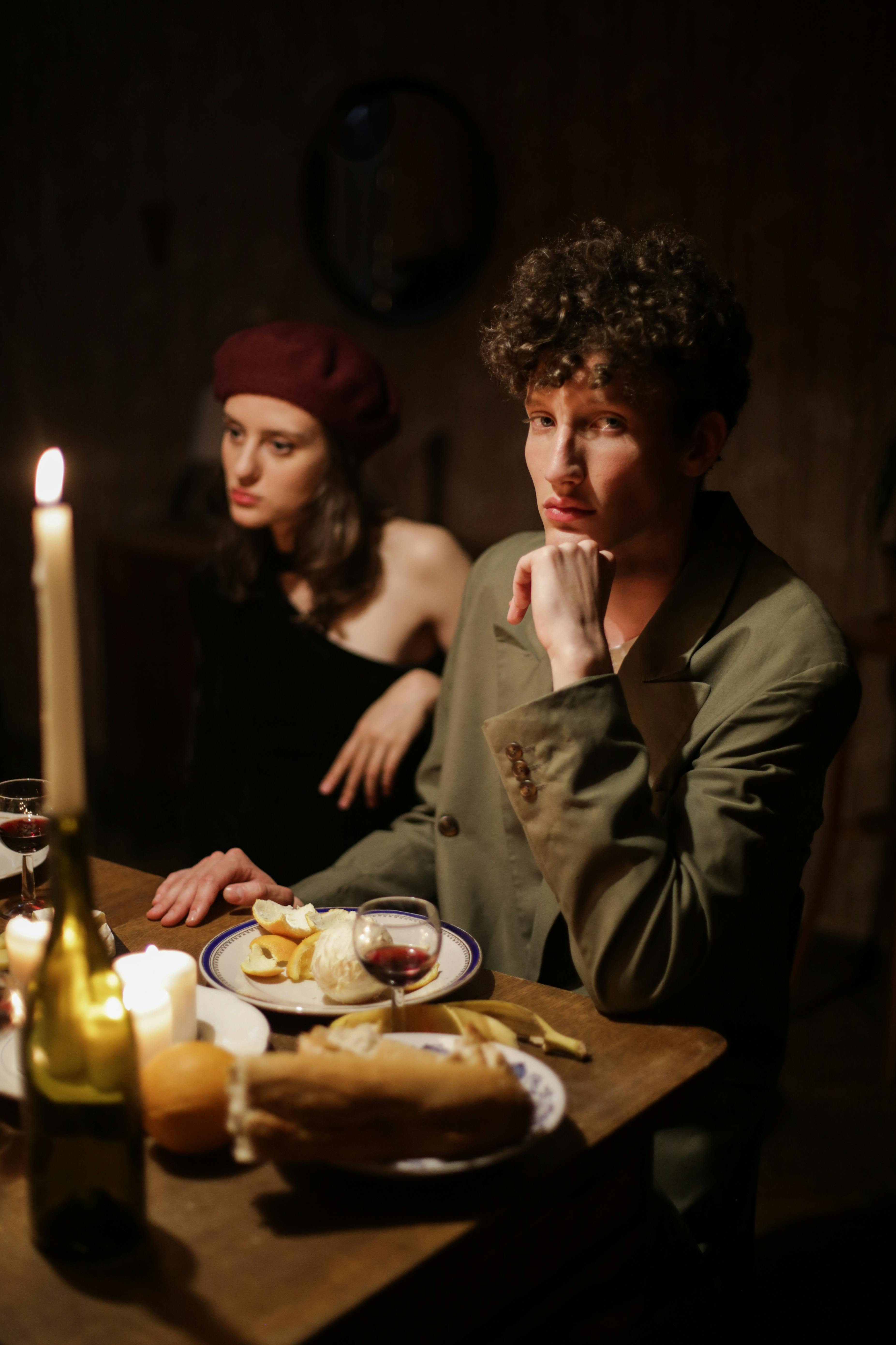 man and woman sitting at table