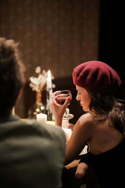 Man and Woman Holding Drinking Glasses