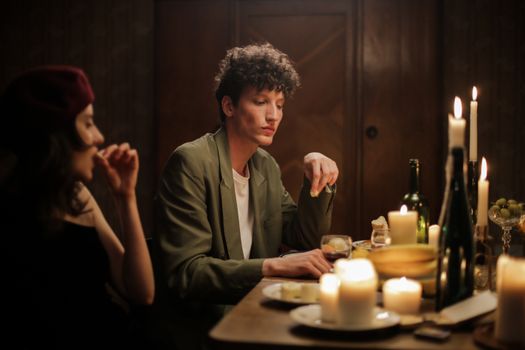 Man in Gray Button Up Shirt Sitting Beside Woman in Gray Long Sleeve Shirt