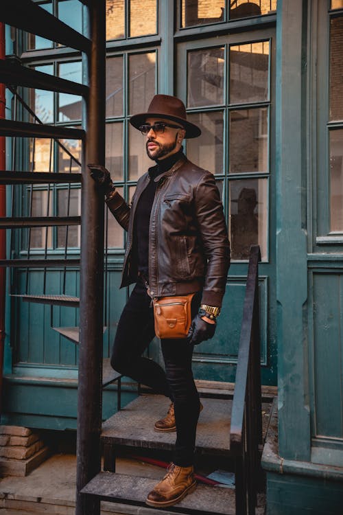 A Fashionable Man Posing on a Staircase