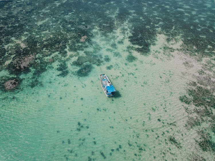 Drone Shot Of A Boat Anchored At Sea