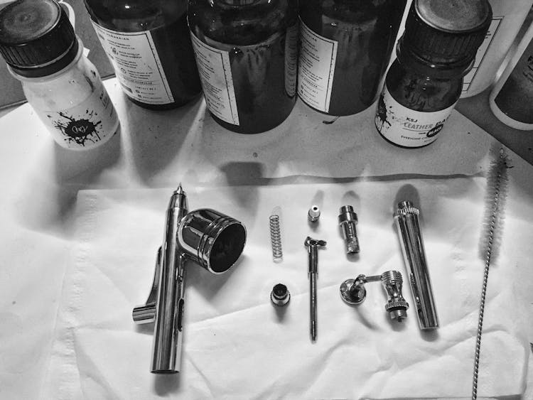 Dismantled Parts Of An Airbrush 