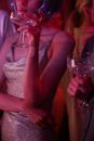Woman in White Lace Sleeveless Dress Holding Clear Wine Glass