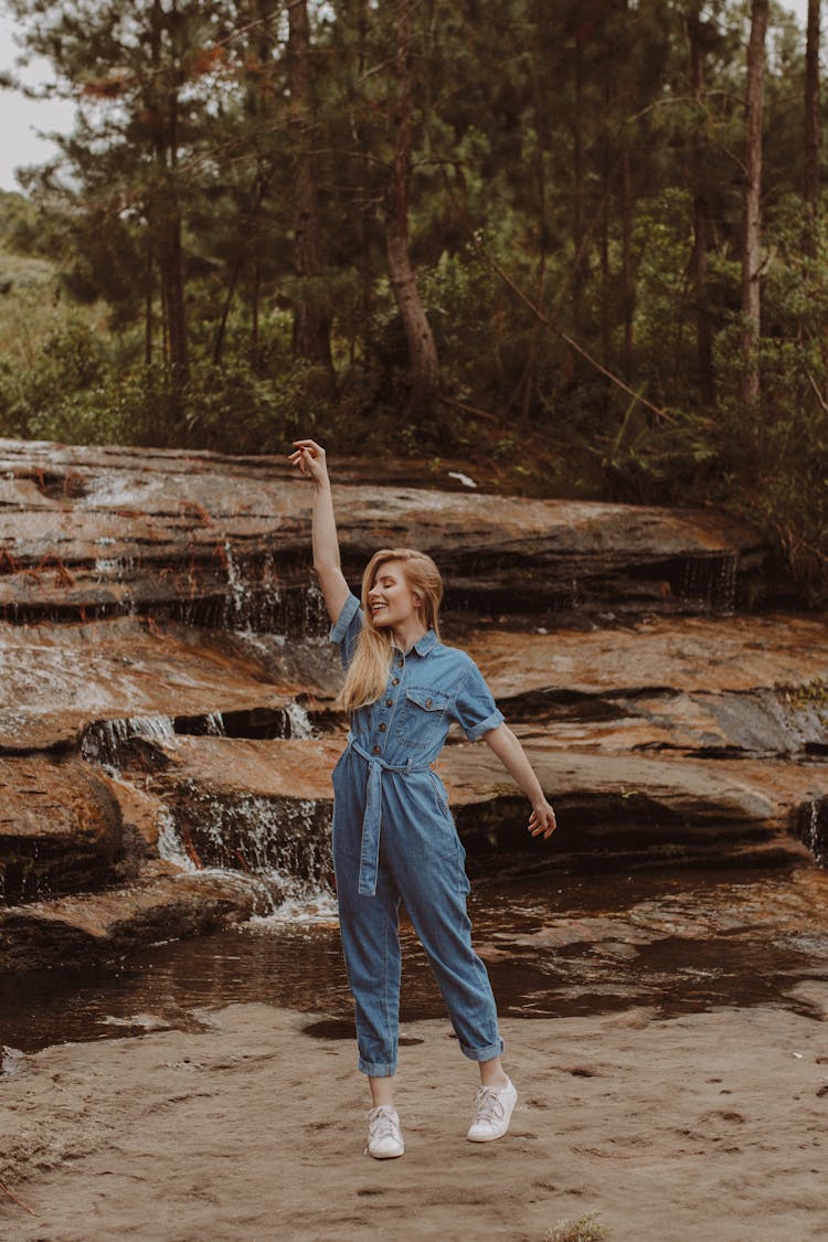 Romantic Woman In Denim Dancing In Nature