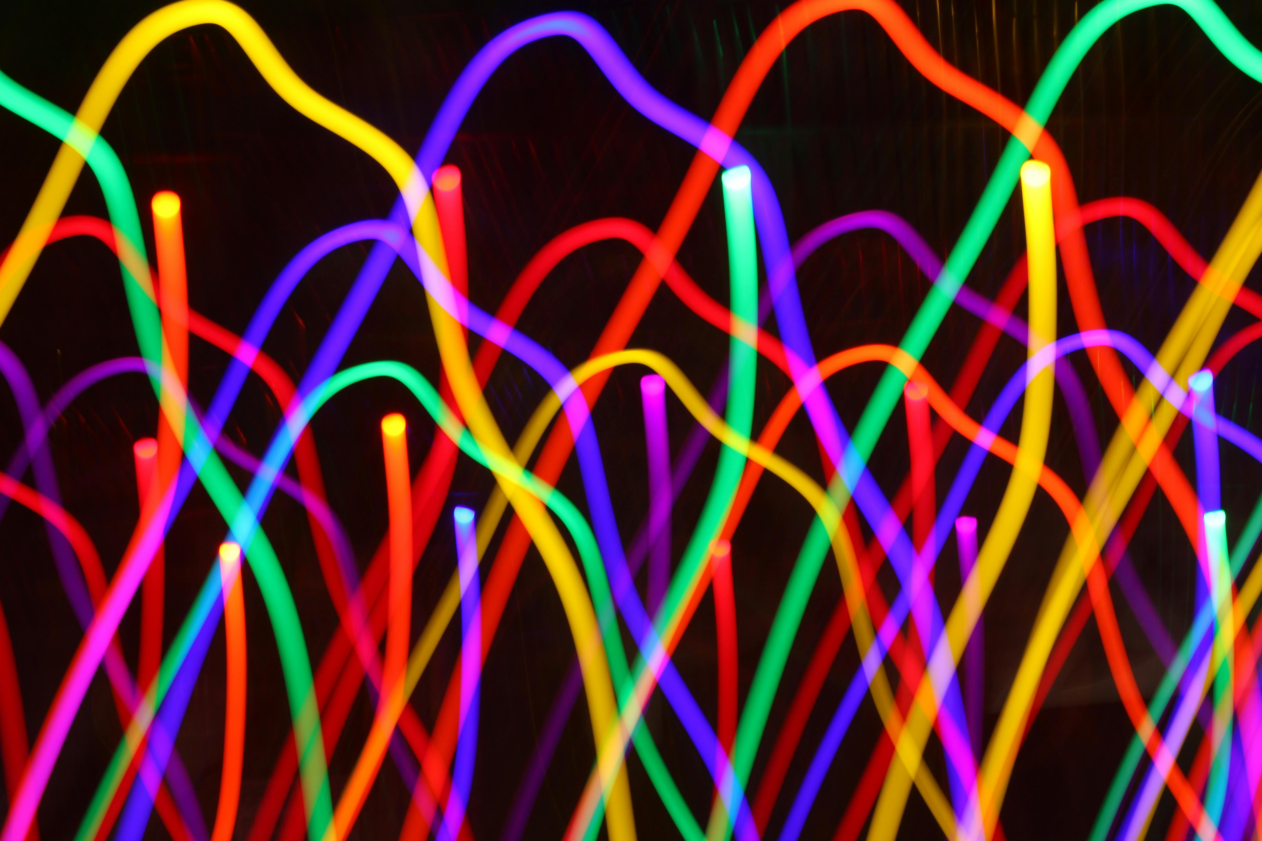 A woman assisting an elderly woman with a tablet, indicating digital literacy and smart device integration for seniors.