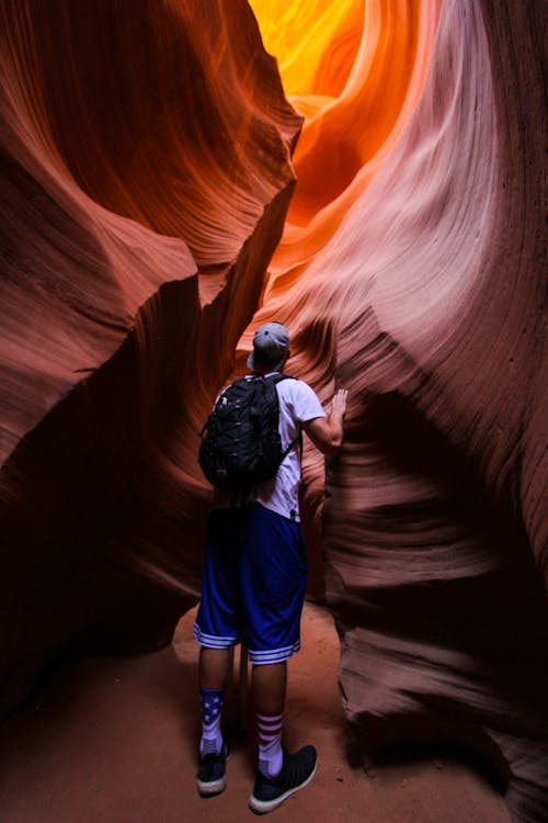 Free Back View of a Person Exploring a Canyon Stock Photo