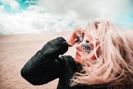 Woman in Black Leather Jacket Wearing Black Framed Eyeglasses