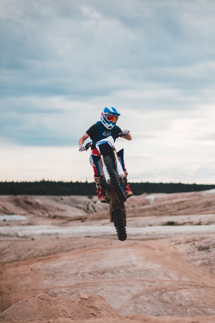 Professional Anonymous Biker Riding On Rear Wheel