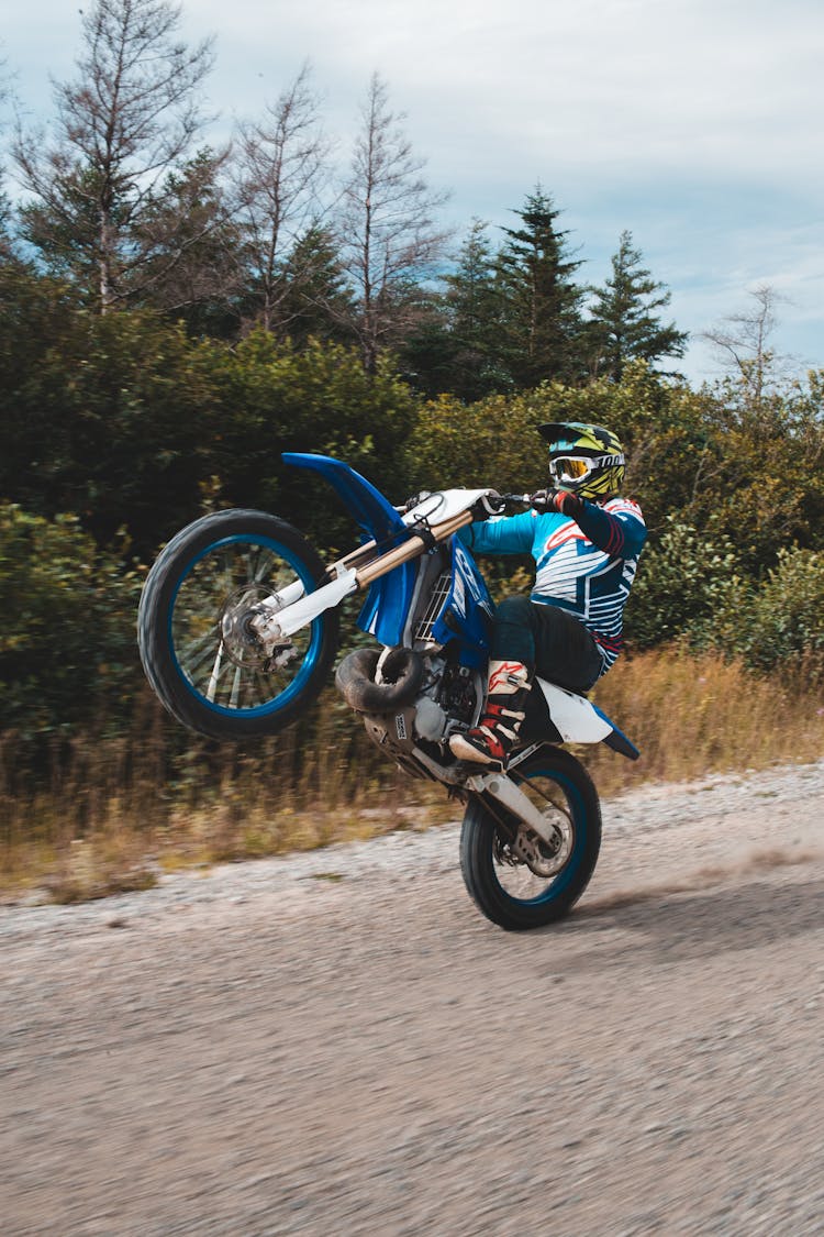 Faceless Man Riding On Rear Wheel