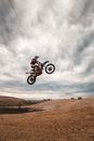 Anonymous man doing stunt on bike