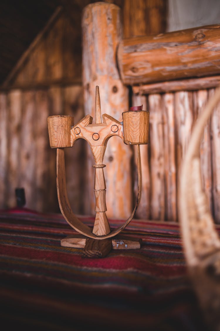 Old Wooden Candlestick Placed On Table