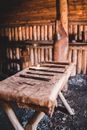 Old table with various carpentry tools placed in aged shabby wooden workshop in Norstead Viking Village in Canada