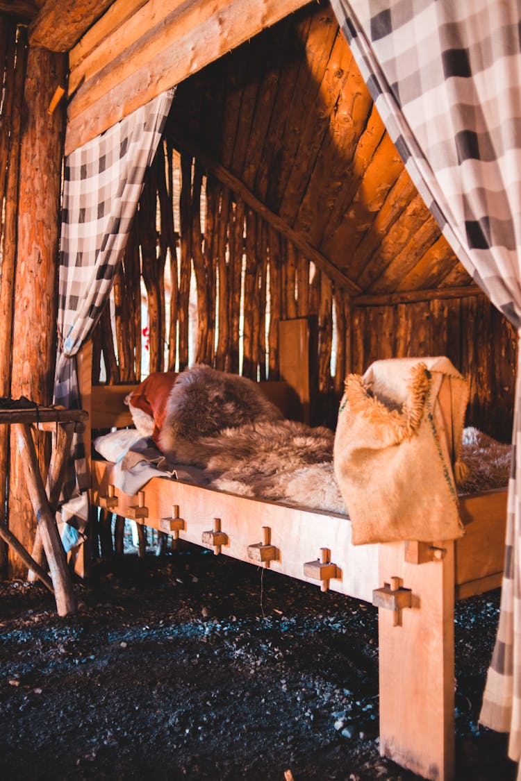 Interior Of Bedroom In Small Lumber House