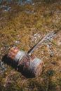 Antique wooden yarn winder on grassy ground
