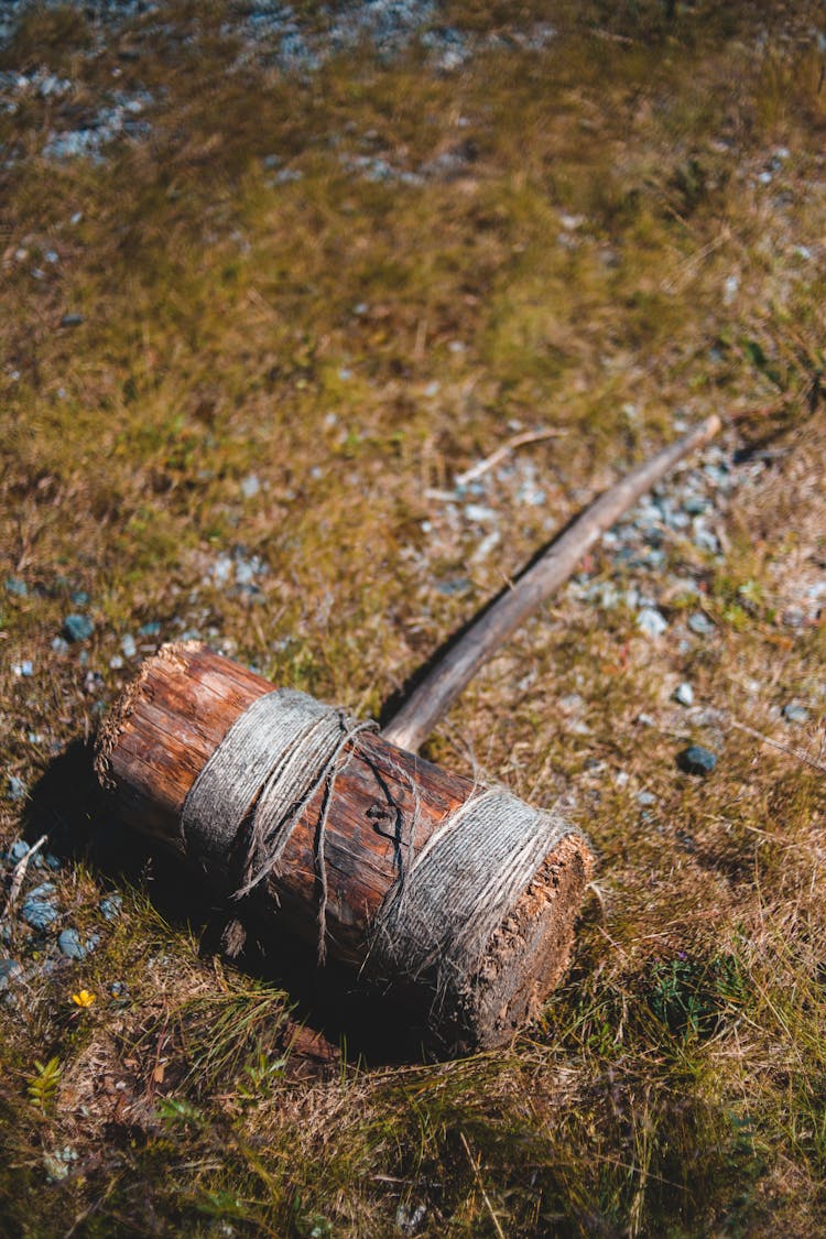 Antique Wooden Yarn Winder On Grassy Ground