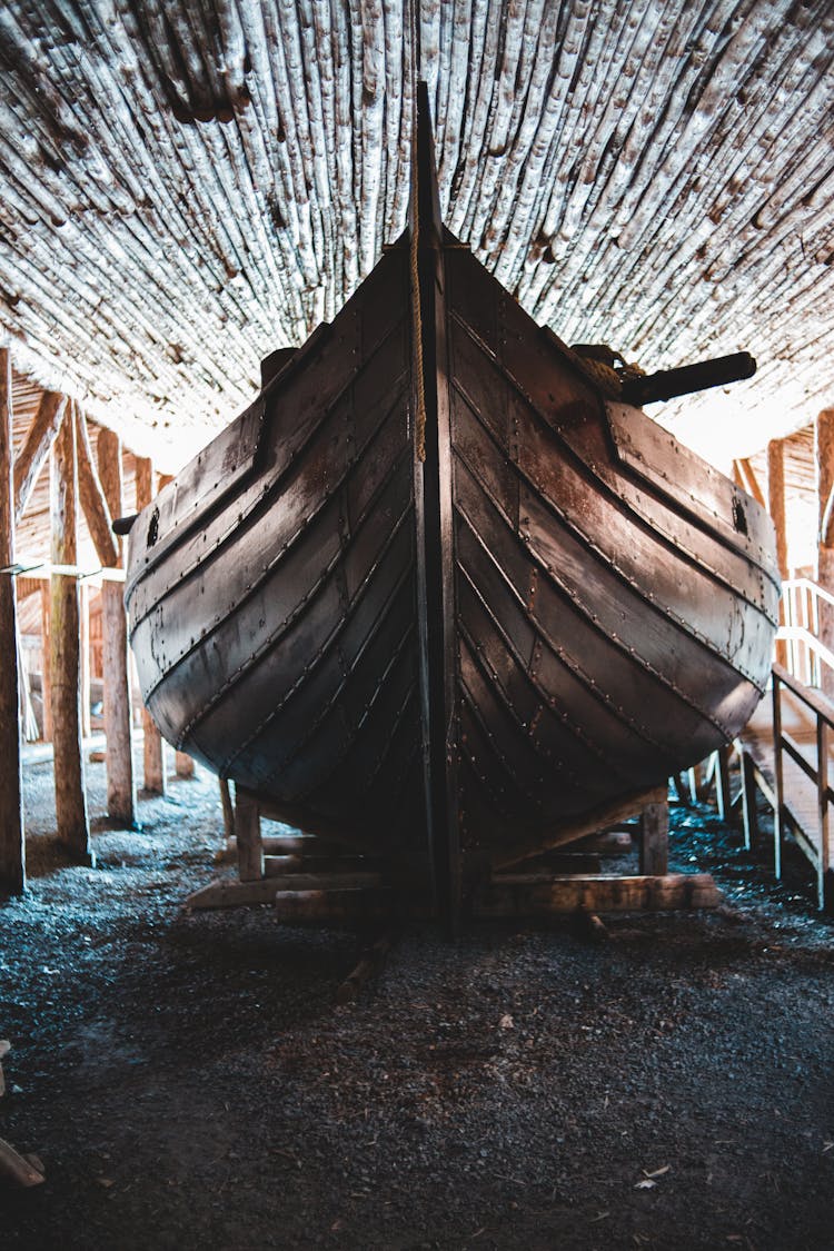 Wooden Boat Under Roof In Storage Building