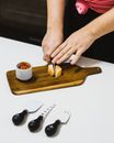 Close Up of Woman Hands Cutting Cheese