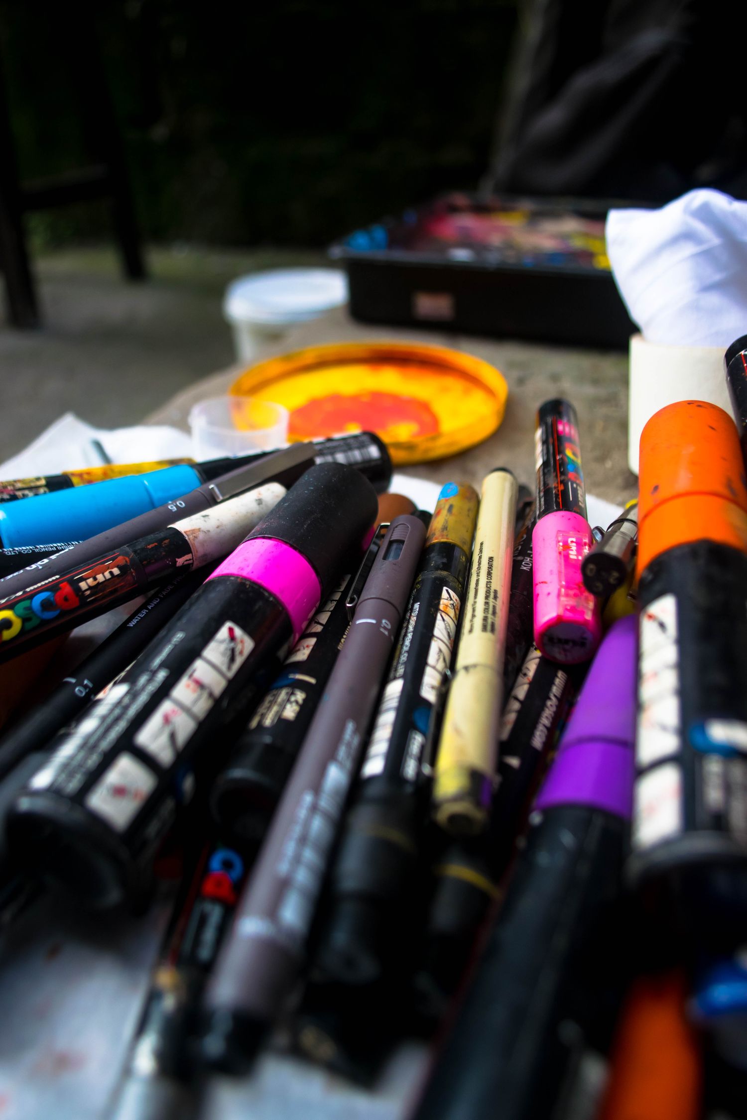 Collection Of Markers And Paints Scattered On Street Free Stock Photo collection-of-markers-and-paints-scattered-on-street-free-stock-photo