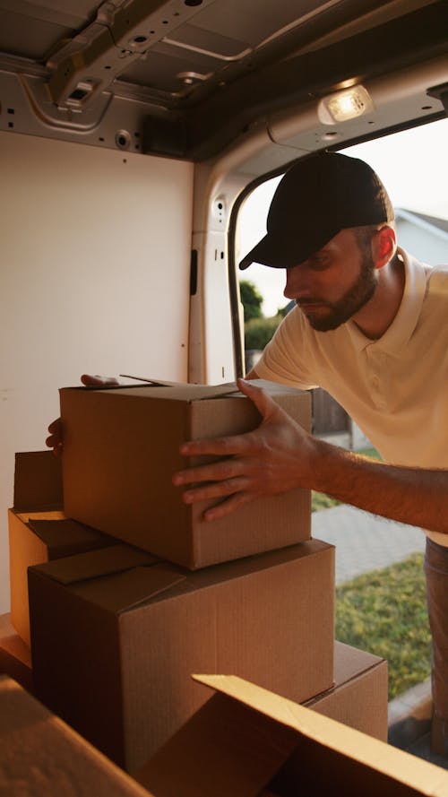 Man Holding Boxes for Delivery