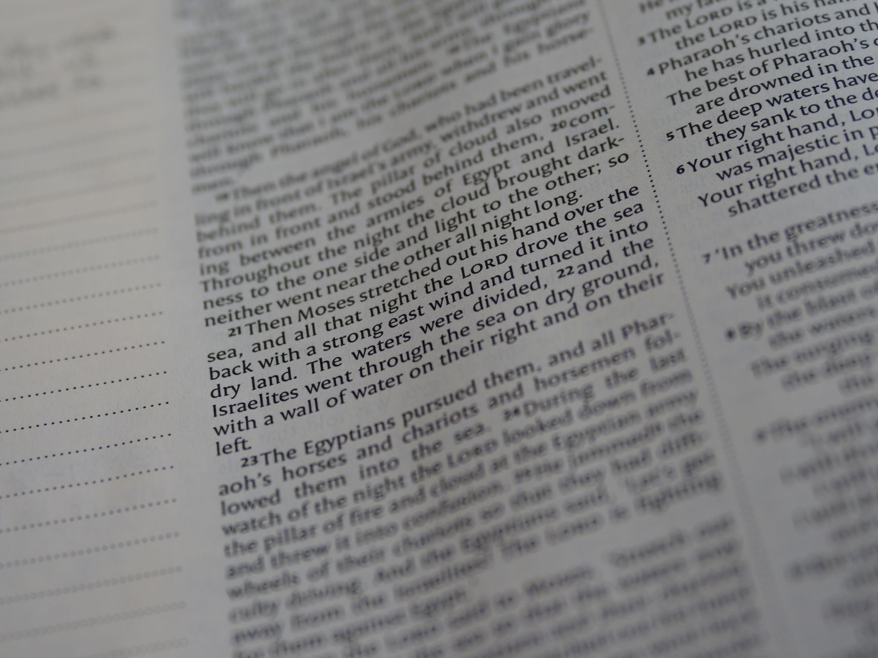 Selective focus image of an Old Testament scripture page from the Bible.