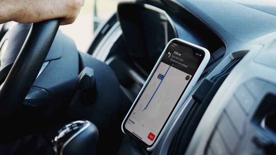 Driver reviewing routes and delivery resources on a phone