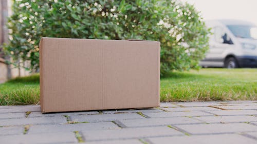 Free Close-up of a Brown Carton Box on the Ground Stock Photo