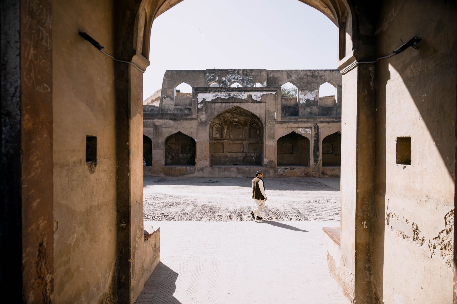 A serene view of a historic courtyard in Lahore with traditional architecture.