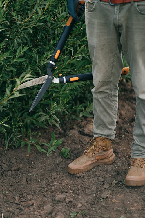 Close-Up Shot of a Person Holding Shears