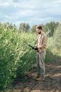 A Man Standing while Holding Shears