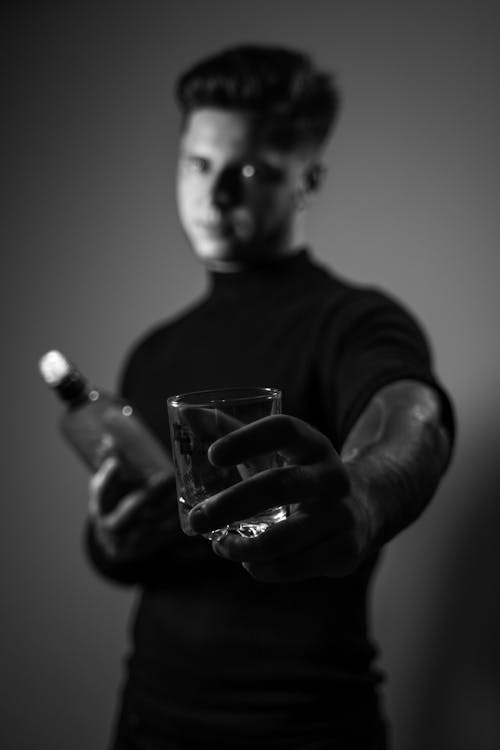  Monochrome Photo of Man Holding a Glass