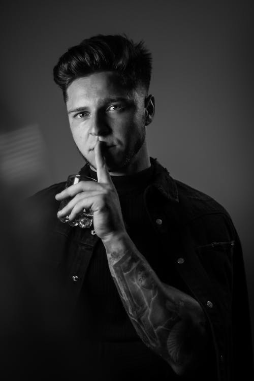  Monochrome Photo of Man Holding a Glass