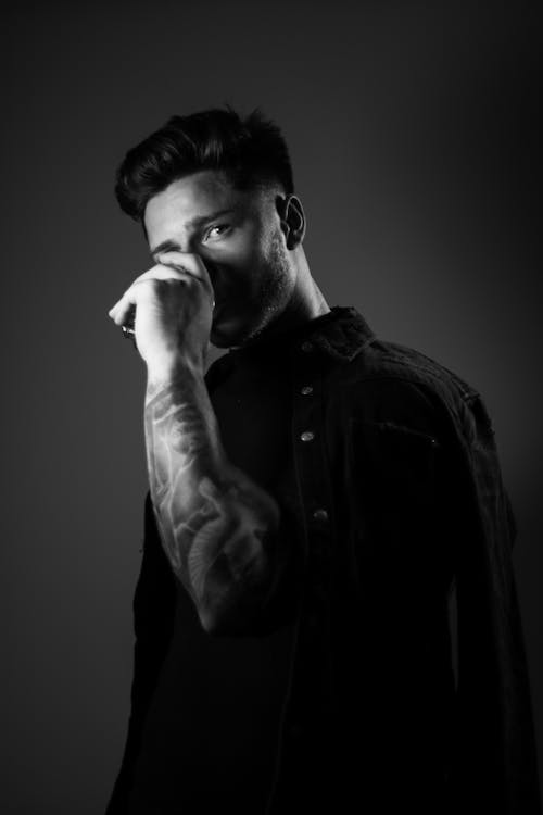 Monochrome Photo of a Man Drinking Beverage