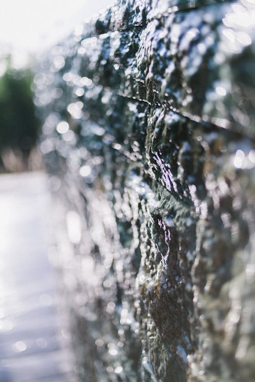 Wet glistening wall in daylight