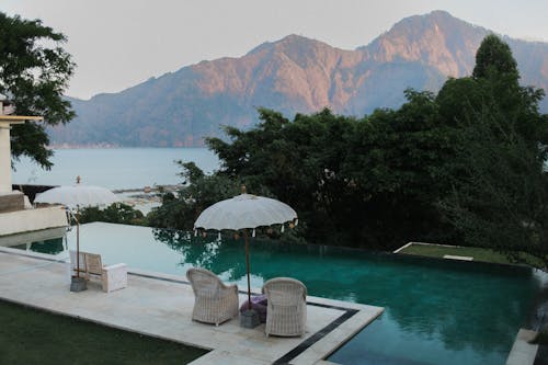 Calm resort terrace with pool against mountains